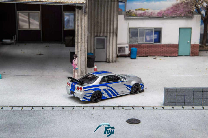 [Preorder] Fuji 1:64 Nissan Skyline GT-R R34 Nismo Z-Tune Silver Blue Livery (3 Variants)