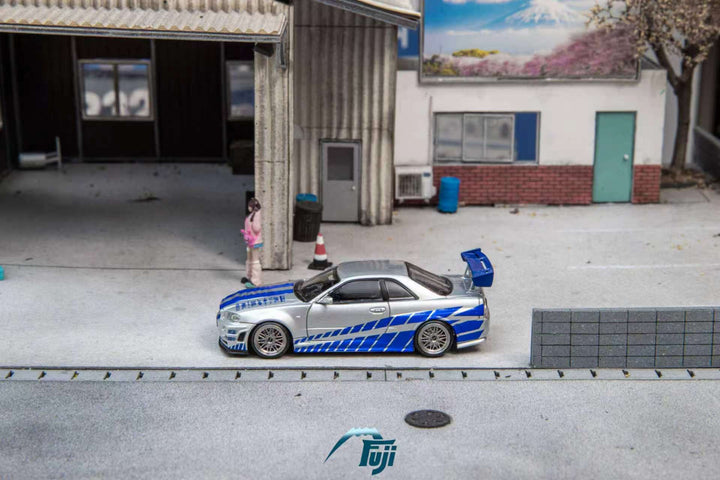 [Preorder] Fuji 1:64 Nissan Skyline GT-R R34 Nismo Z-Tune Silver Blue Livery (3 Variants)