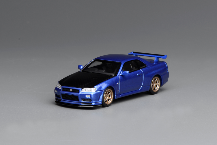 [Preorder] MOTORHELIX 1:64 NISSAN SKYLINE GT-R (R34) V-SPEC II CUSTOMIZED BAYSIDE BLUE W/ CARBON FIBER BONNET M63450