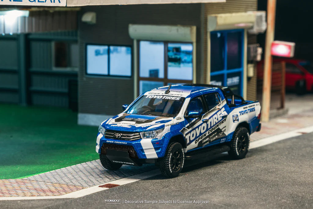 Tarmac Works 1:64 Toyota Hilux Toyo Tires T64-041-TOYO