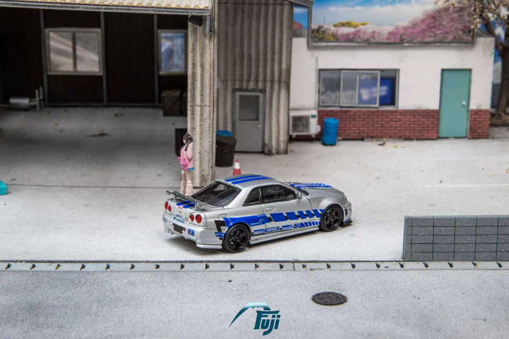 [Preorder] Fuji 1:64 Nissan Skyline GT-R R34 Nismo Z-Tune Silver Blue Livery (3 Variants)