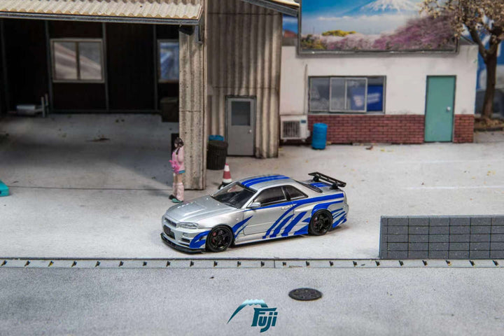 [Preorder] Fuji 1:64 Nissan Skyline GT-R R34 Nismo Z-Tune Silver Blue Livery (3 Variants)