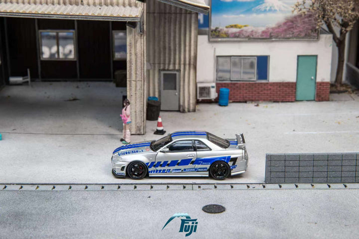 [Preorder] Fuji 1:64 Nissan Skyline GT-R R34 Nismo Z-Tune Silver Blue Livery (3 Variants)