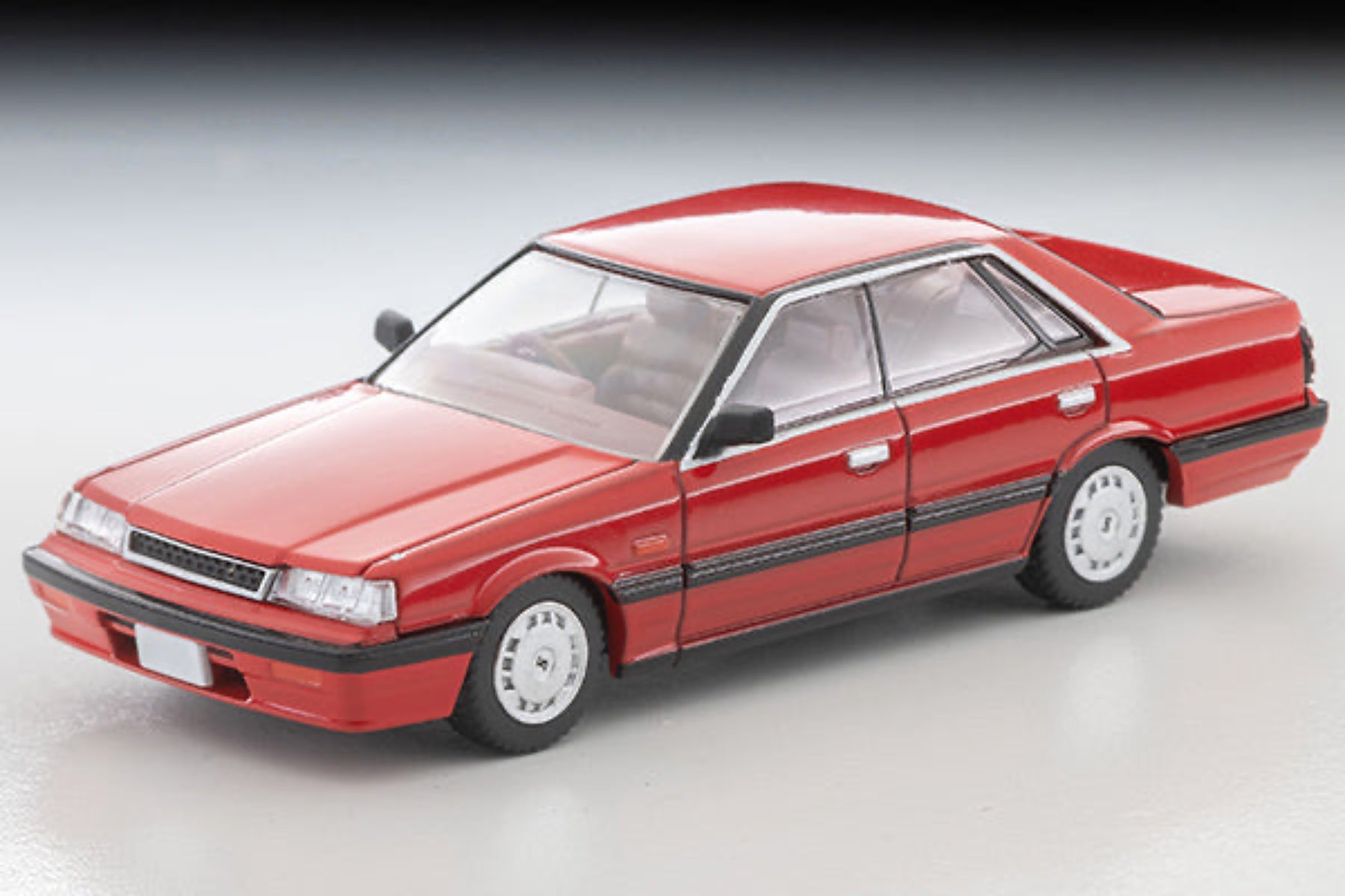 Tomytec TLVN 1:64 Nissan Skyline 4-door HT 1800 Passage (red) 1987